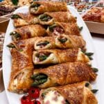 Asparagus Puff Pastry Bundles 7 Asparagus puff pastry bundles served on a plate, perfect for fall dinner parties