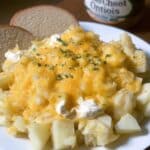 Crockpot Cheesy Potatoes 7 Crockpot cheesy potatoes served in a white slow cooker