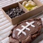 Fudgy football brownies arranged on a game day serving tray
