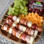 Healthy school snacks with kabobs of meat, cheese, and grapes