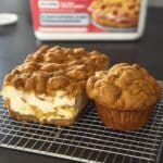 Keto Pumpkin Cheesecake Muffins with golden streusel topping