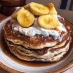 Pumpkin Protein Pancakes 7 Stack of pumpkin protein pancakes with maple syrup