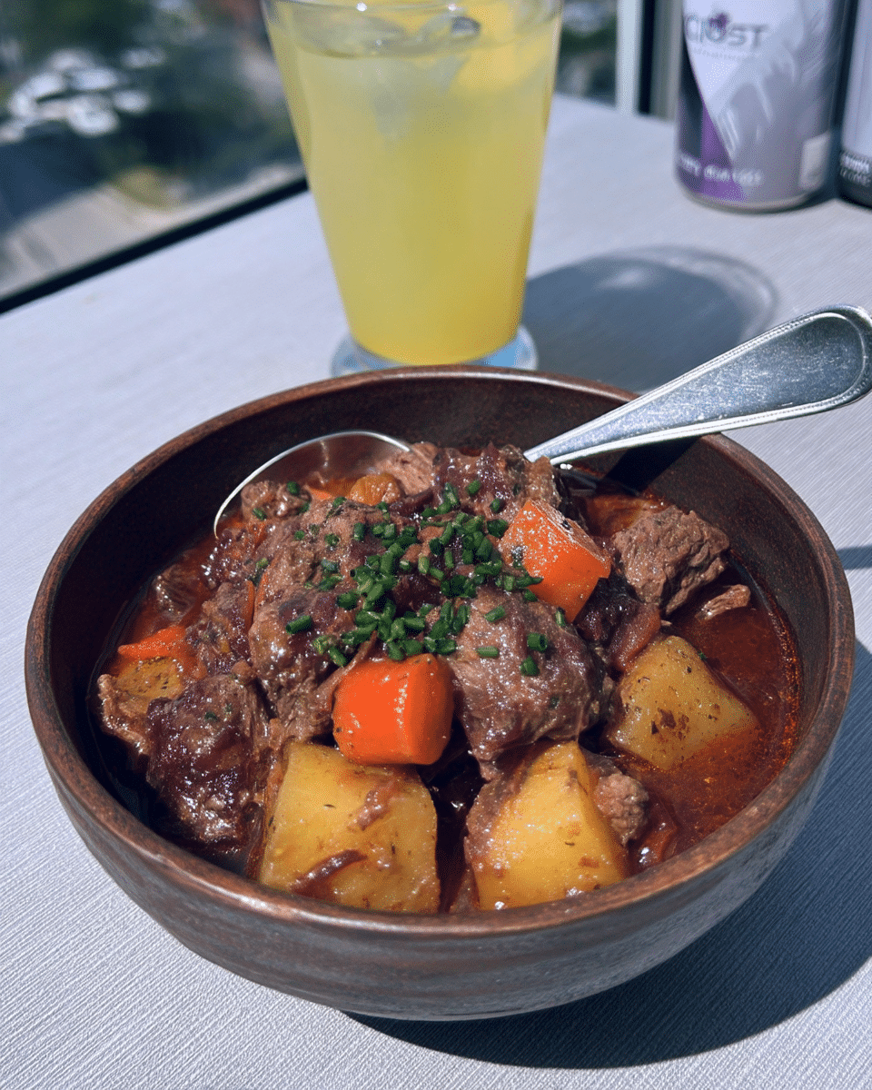 A table setting with Instant Pot Beef Stew served with crusty bread.