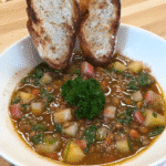 Lentil soup with garlic crostini in a bowl