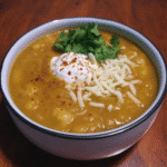 Mexican Street Corn Soup 7 A bowl of Mexican street corn soup garnished with cilantro and queso fresco.