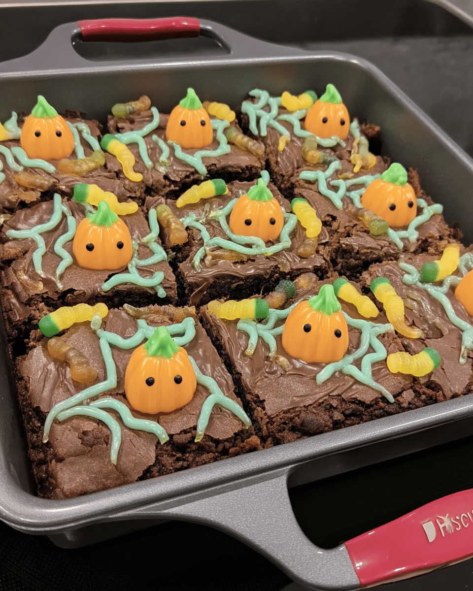 Pumpkin Patch Brownies served on a plate with a glass of milk.