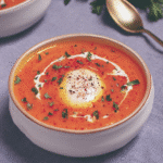 Spicy Butternut Squash and Sweet Potato Soup 7 Spicy Butternut Squash and Sweet Potato Soup in a bowl, garnished with coconut milk.