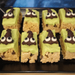 Witch Halloween Rice Krispie Treats 7 Delicious witch Halloween rice krispie treats on a platter.