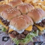 Big Mac Sliders 7 Big Mac sliders on tray with sesame seed buns and lettuce