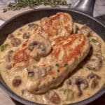 Creamy mushroom chicken in skillet with golden sear
