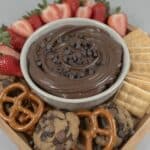 Bowl of brownie batter dip topped with mini chocolate chips