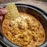 Crockpot Buffalo Chicken Football Dip 7 Football dip served hot in a crockpot with melted cheese