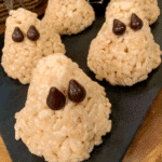 Close-up of a Rice Krispie Treat Ghost decorated with candy eyes.