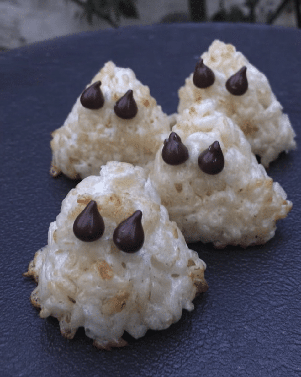 A hand holding a Rice Krispie Treat Ghost.