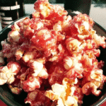 A close-up of Bloody Red Velvet Popcorn on a table, ready to be enjoyed.