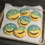 Cookie Monster Cookies served with a glass of milk.