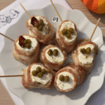 Creepy Skewered Salami Eyeballs on a platter.