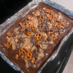 Close-up of Halloween Crack Bark Candy with pretzels, peanuts, and chocolate.