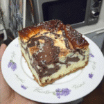 No Bake Cheesecake Brownies 7 A flat lay of the ingredients needed to make No Bake Cheesecake Brownies, arranged on a marble countertop.