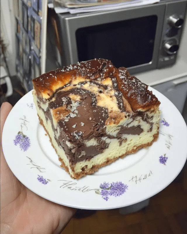 No Bake Cheesecake Brownies 8 A flat lay of the ingredients needed to make No Bake Cheesecake Brownies, arranged on a marble countertop.
