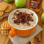 A close-up shot of Maple Bacon Dip served with apple slices and graham crackers.