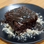 No-bake caramel brownies served on a plate with a scoop of ice cream.