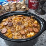 Polish Sausage Sauerkraut Potatoes 7 The dish simmering in a skillet.