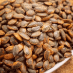 A bowl of roasted watermelon seeds.