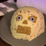 A spooky and delicious Skellington Cheese Ball, perfect for Halloween parties.