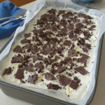White Chocolate Halloween Oreo Bark on a parchment-lined baking sheet.