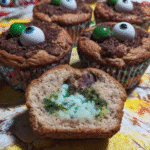 Witch Cauldron Brownie Bites 7 Witch Cauldron Brownie Bites arranged on a festive Halloween platter.