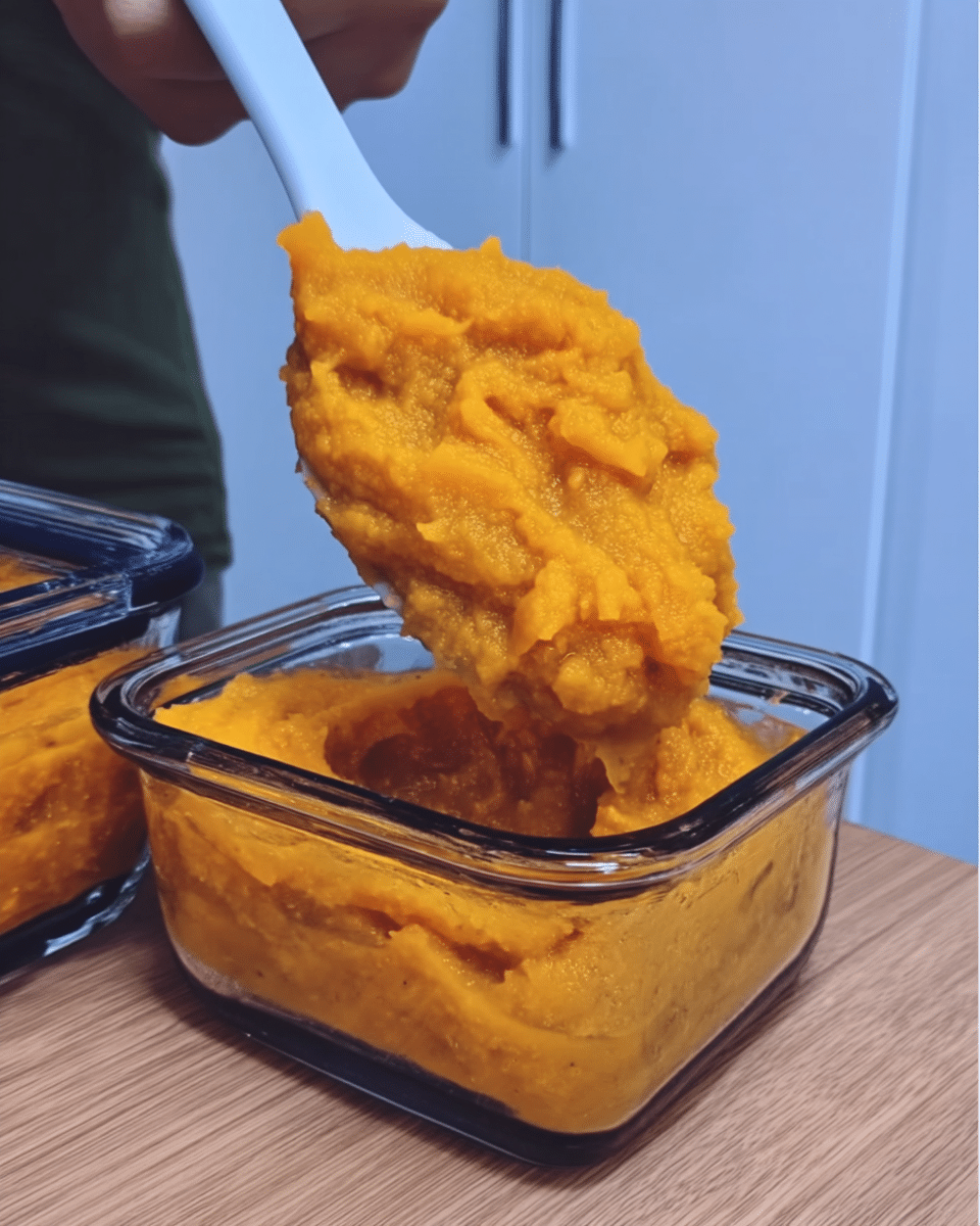 Homemade Pumpkin Purée 9 Pumpkin halves roasting cut-side down on a parchment-lined baking sheet.